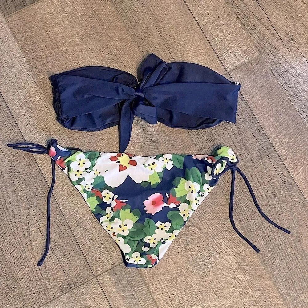Barely used Shekini Bathingsuit Floral Bottoms and Staples Blue Top. Size M.